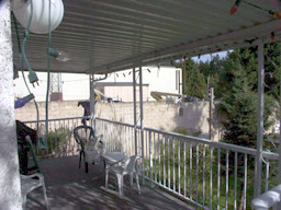 Rear deck east to telUS prop. seller says great neighbour